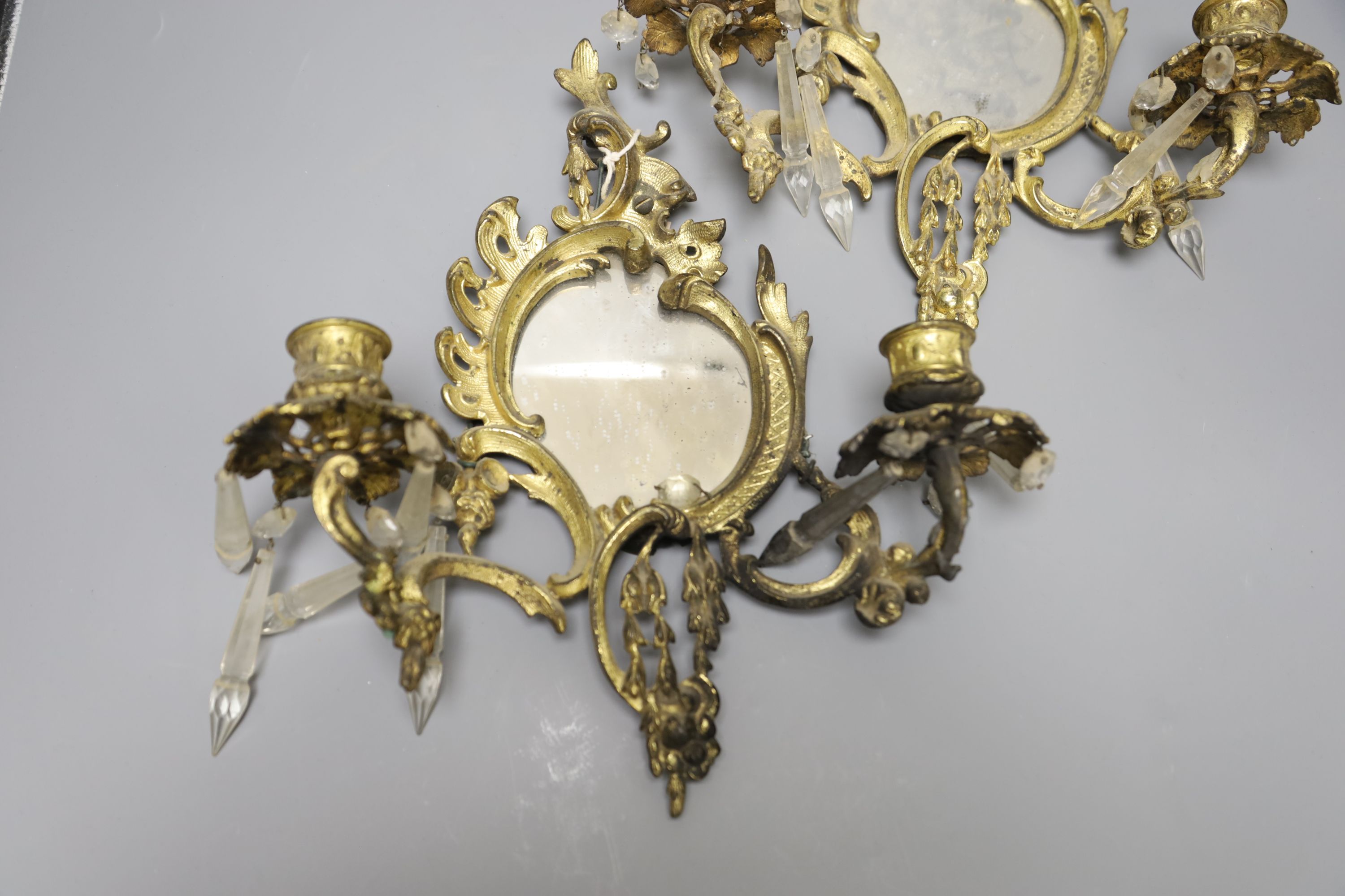 A pair of ormolu girandoles with lustres (a.f.)